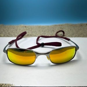 Oakley Fire Iridium Sunglasses. Some marks to lenses 31MM h x 52 MM W